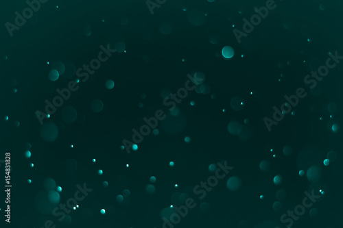 Bokeh Background Very dark (mostly black) cyan.