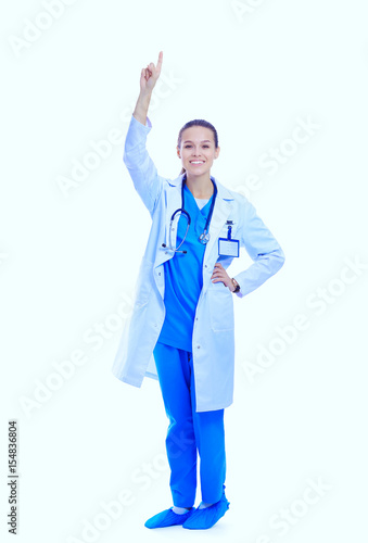 A portrait of a female doctor pointing isolated on white background