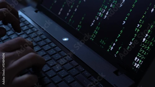 Hacker, Programmer, With the help of the Keyboard, Use the Program code on the Computer for exposure, hacking, protection, Online, Offline, Security Internet, with the Matrix Effect. Trojan Virus.