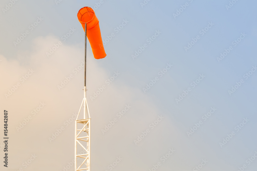 Windsock against blue sky and clouds Windsock against blue sky and clouds