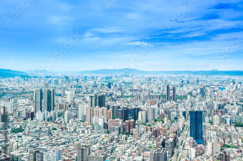 Asia Business concept for real estate and corporate construction - panoramic modern cityscape building bird eye aerial view under sunrise and morning blue bright sky, shot in Taipei 101, Taiwan