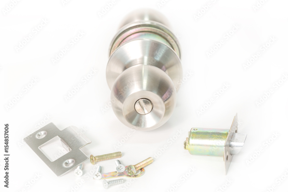 Stainless steel round ball door knob components isolated on the white background as Locksmith concept. Stainless steel round ball door knob components isolated on the white background as Locksmith concept.