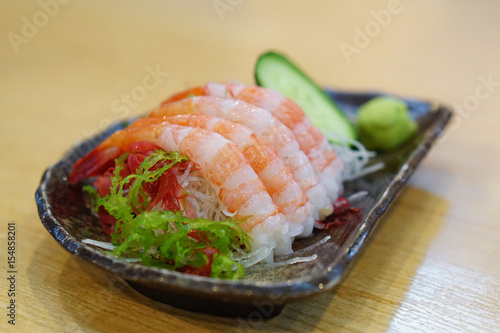 Tableau sur toile Fresh Amaebi (Sweet Shrimp) Sashimi Set served with wasabi, zucchini seaweed and grated radish on plate