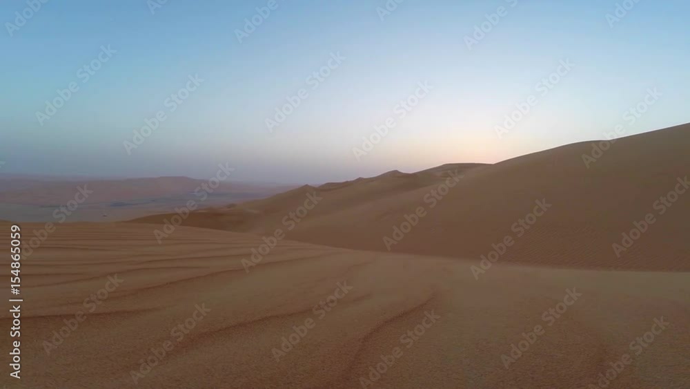 sunrise in Liwa desert, part of Empty Quarter, the largest sand desert in the world sunrise in Liwa desert, part of Empty Quarter, the largest sand desert in the world