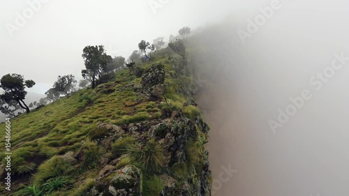 hiker coming down a hill in Simien mountains, Ethiopia