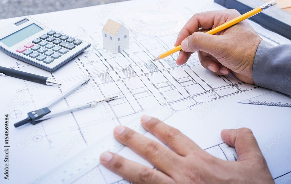 Architect working with plan design.Concepts idea of architecture,construction,engineering. Architect working with plan design.Concepts idea of architecture,construction,engineering.