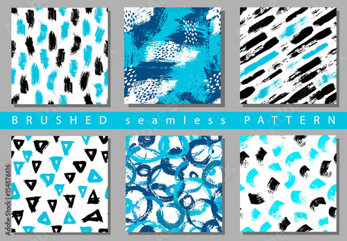Vector Set of seamless pattern with brush stripes and strokes. Black blue color on white background. Hand painted grange texture. Ink geometric elements. Fashion modern style. Endless fabric print.