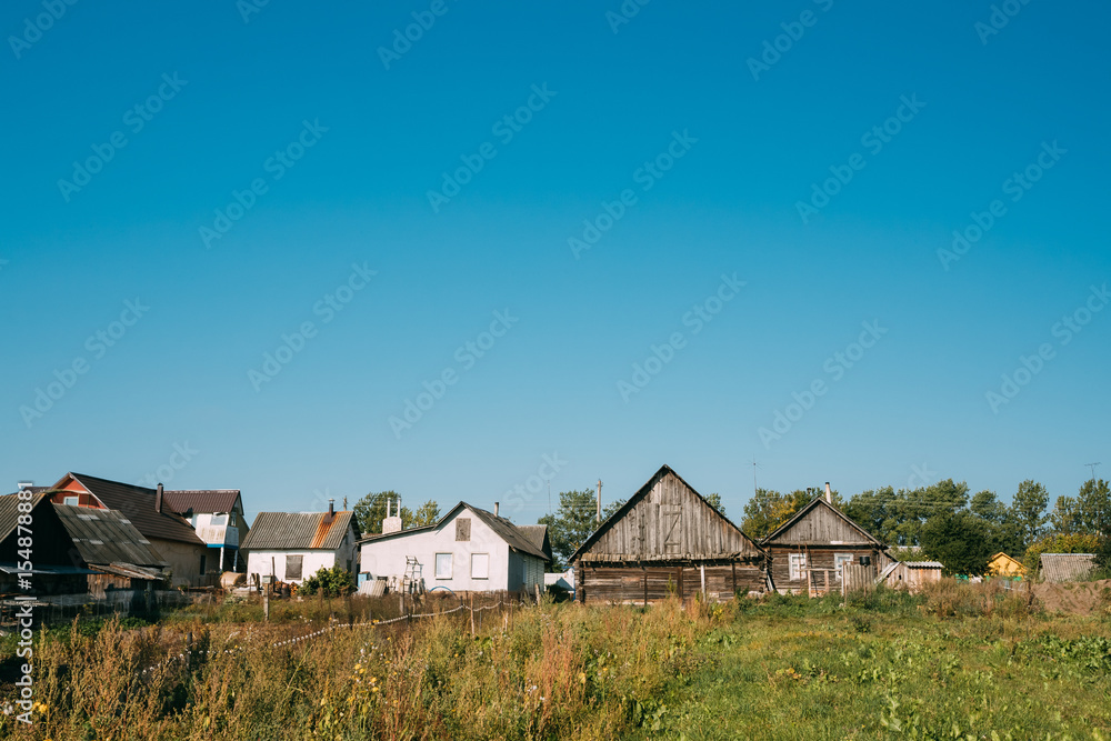 Old Russian Traditional Wooden Houses In Village Or Countryside 