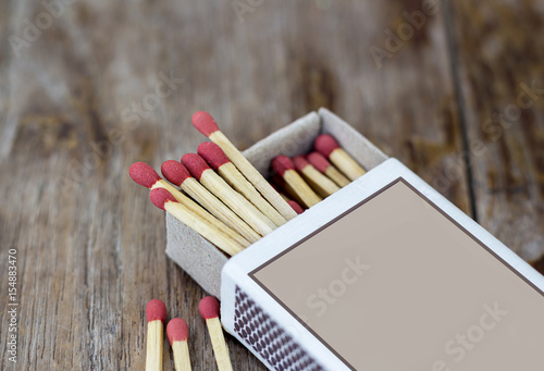 Box of matches on a wooden table, shot at close-up
