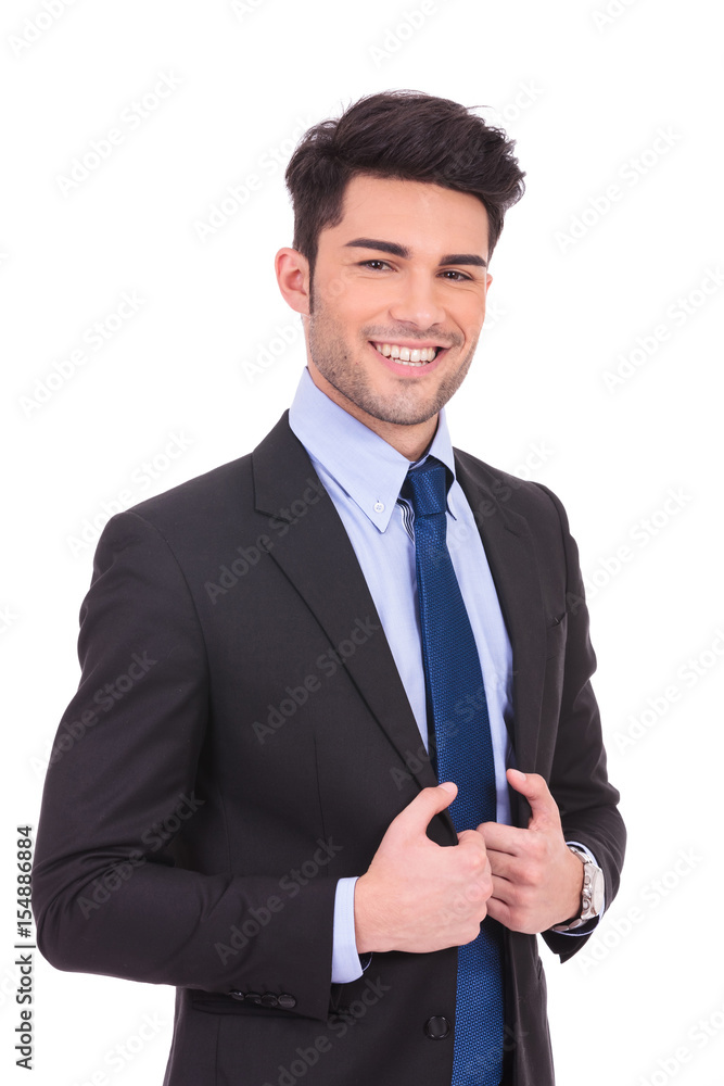 happy young business man holding his collar happy young business man holding his collar