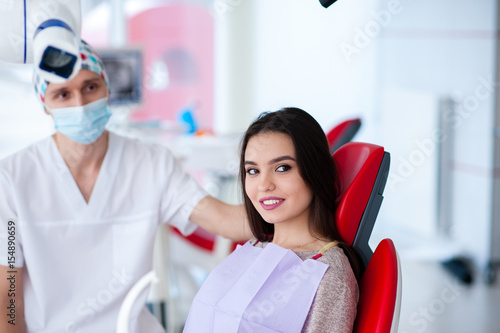 Portrait of a dentist and a beautiful girl in dentistry.
