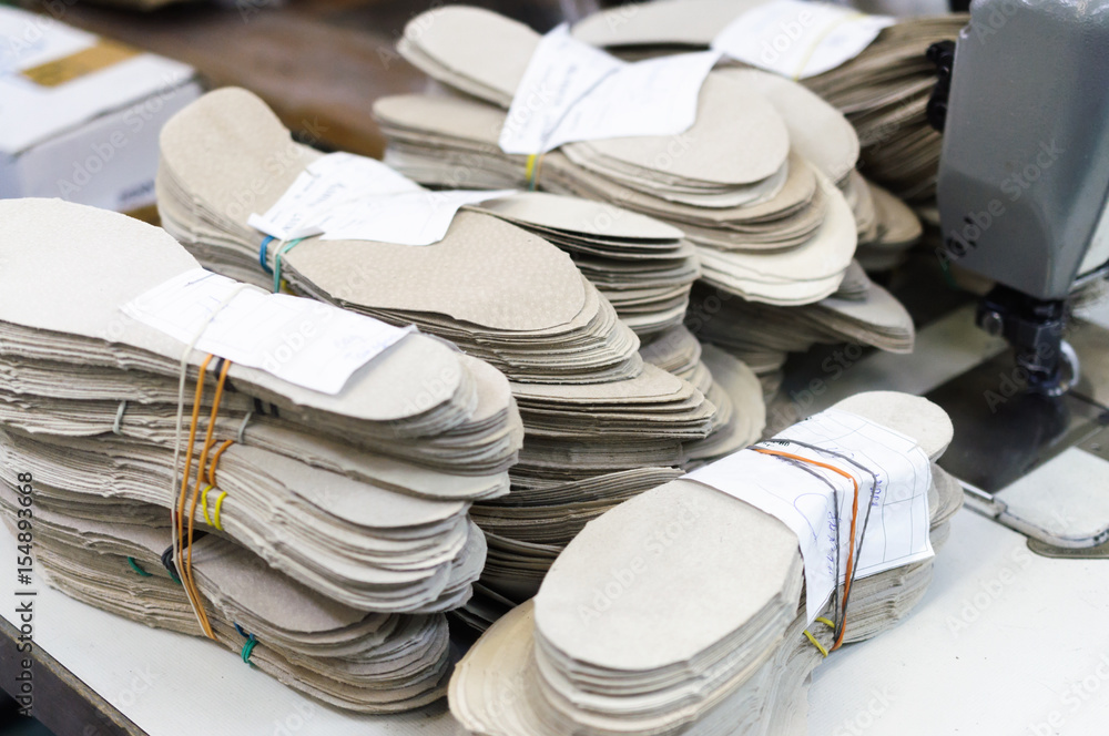Stacks of leather shoe insoles