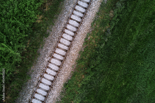 Aerial view of railway track through countryside, drone top view