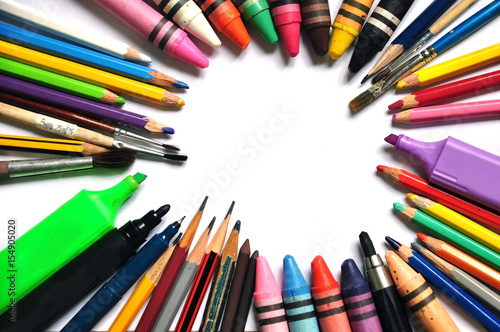 A set of color tools for drawing on a white background: markers, crayons, paints, pencils. Space for text.