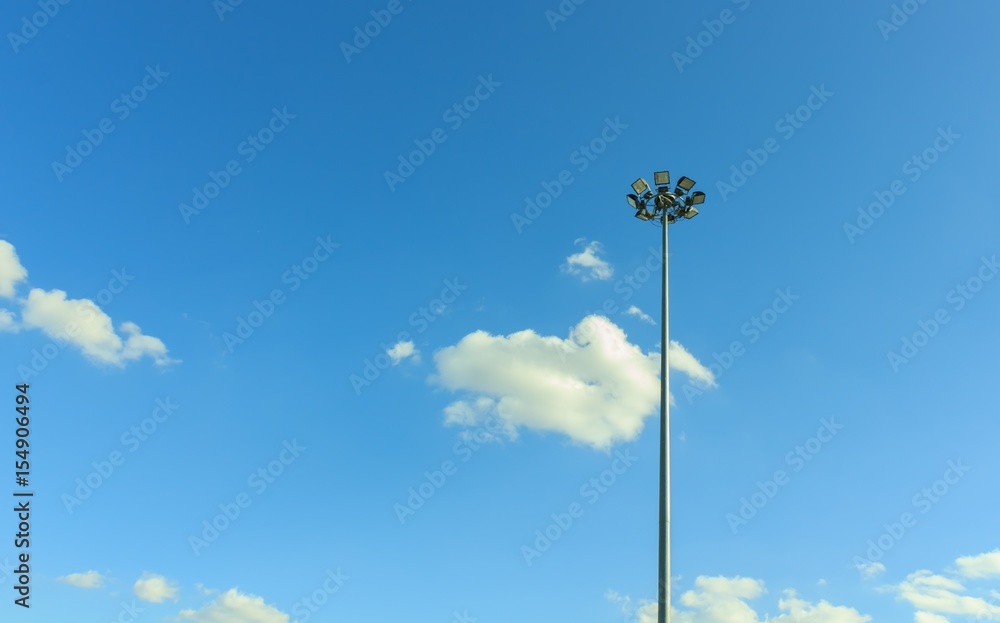 Spotlight pole with blue sky