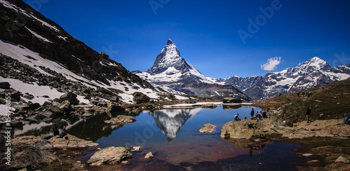 Matterhorn Peak reflection in summer at Riffelsee lake, Gornergrat station, Zermatt, Switzerland.