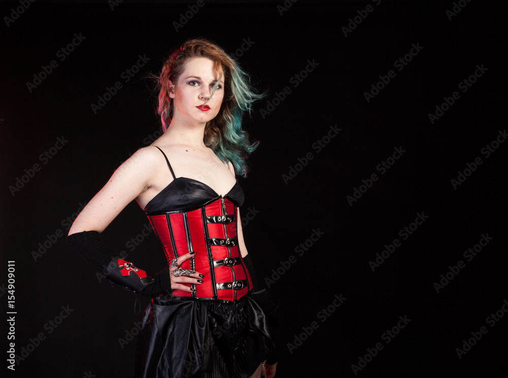 Sexy sensual woman in fetish red leather corset on black background in  studio photo. BDSM and dominatrix Stock Photo | Adobe Stock