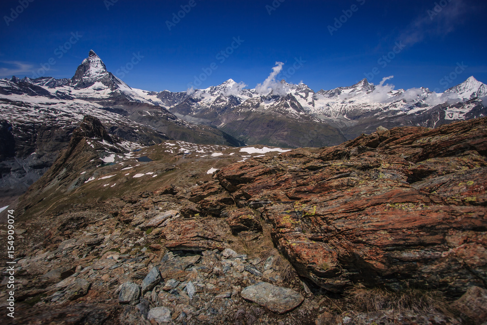 Trail with view of Matterhorn Peak in summer, Zermatt, Switzerland.;