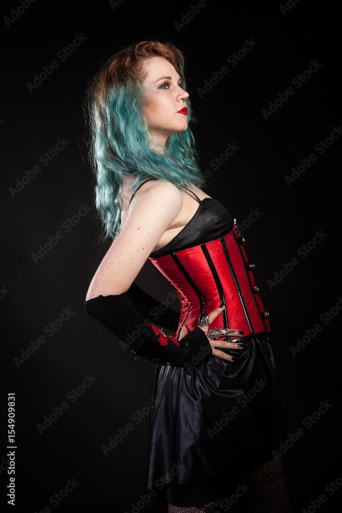 Attractive woman in fetish red leather corset on black background in studio  photo. BDSM and dominatrix Stock Photo | Adobe Stock