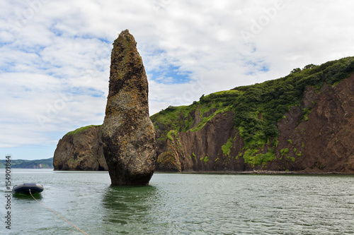 Sea stack Womans happiness in the Avacha Bay of the Pacific Ocean.