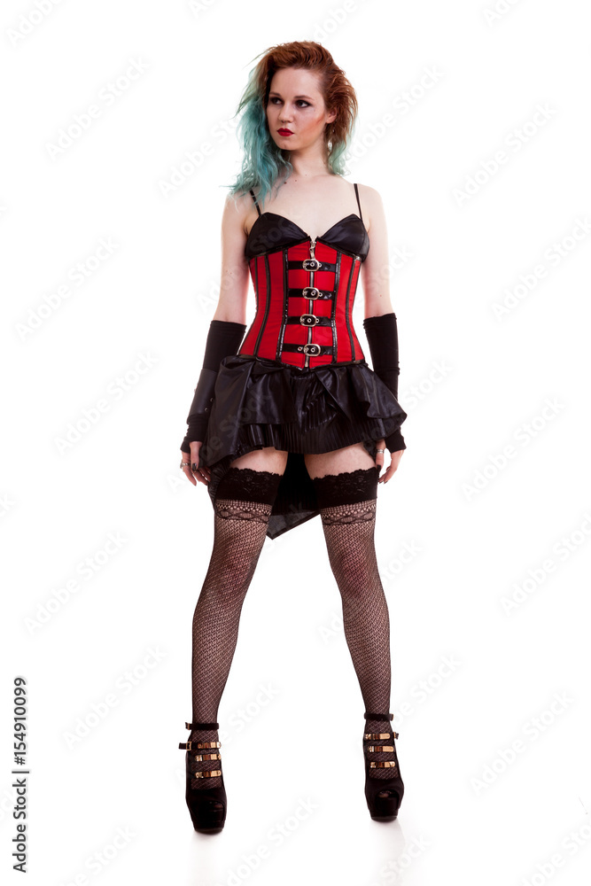 Sensual BDSM model in leather corset isolated on white background in studio photo Sensual BDSM model in leather corset isolated on white background in studio photo