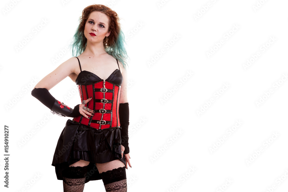 Beautiful BDSM model in leather corset isolated on white background in studio photo Beautiful BDSM model in leather corset isolated on white background in studio photo