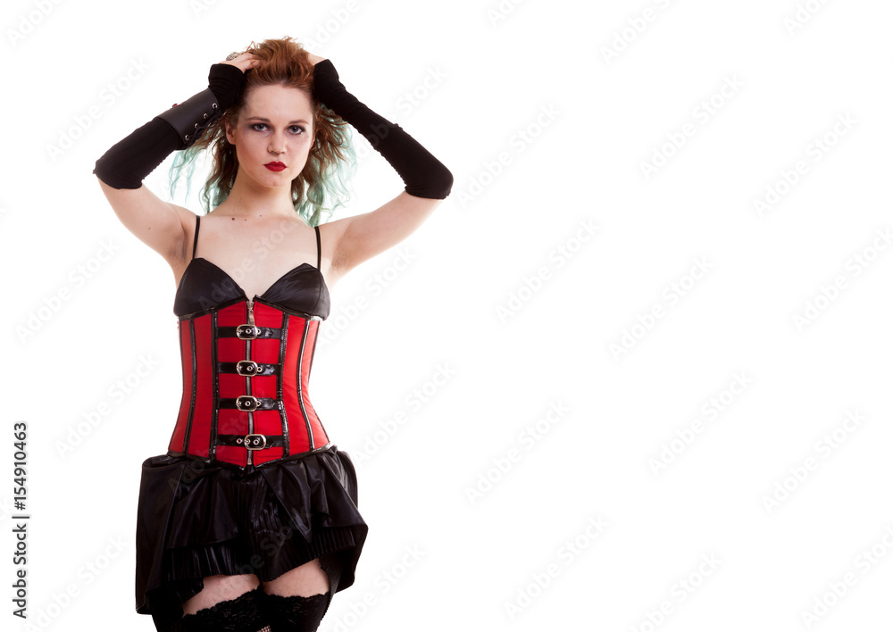 BDSM model in leather corset posing on white background in studio photo BDSM model in leather corset posing on white background in studio photo