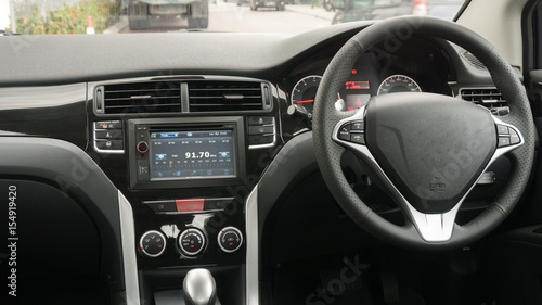 Driver's seat in the car with a white interior