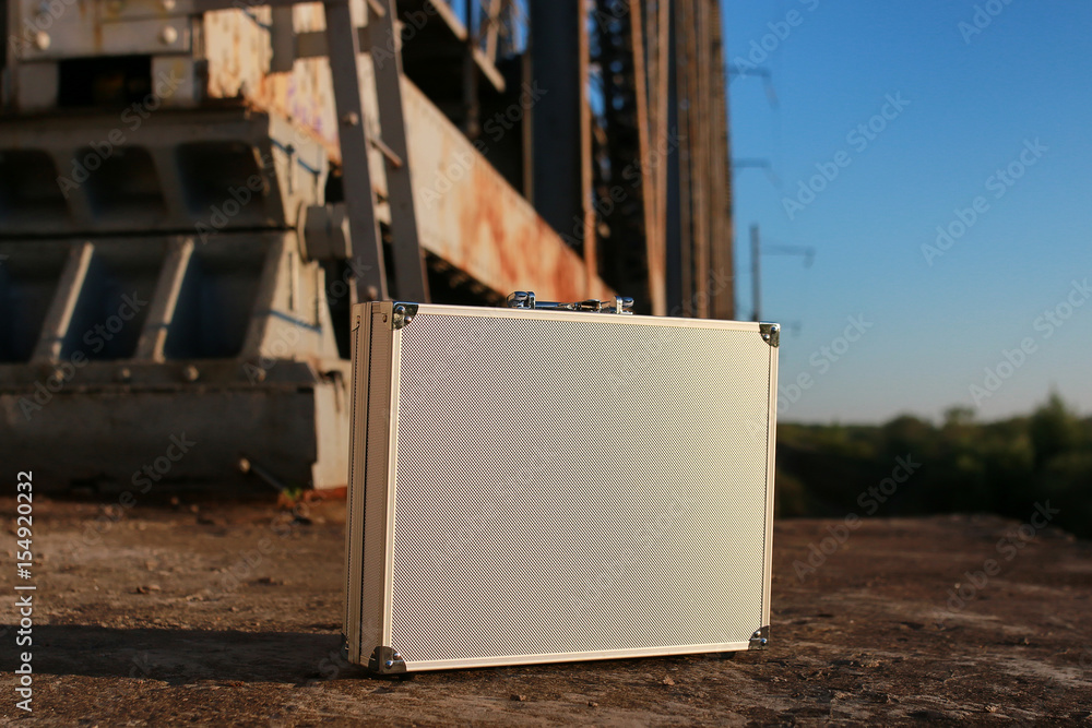 silver metal case with money transfer concept silver metal case with money transfer concept