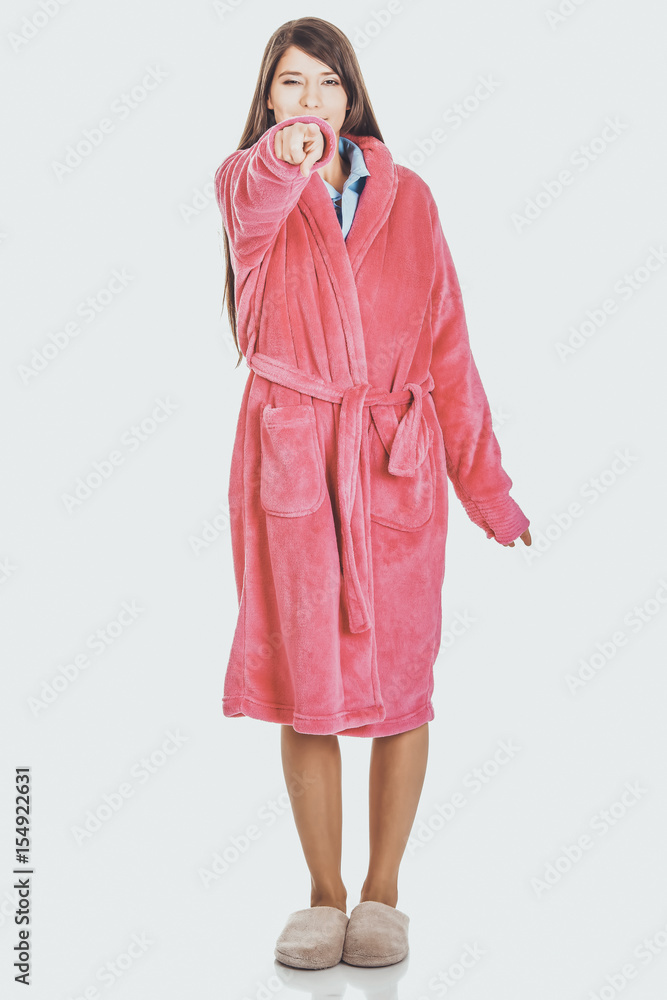 Woman in pink bathrobe pointing on you. Woman in pink bathrobe pointing on you.