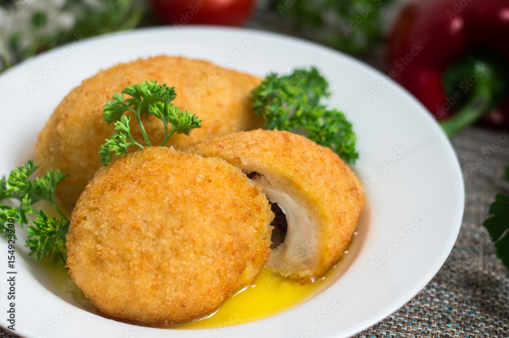 Chicken cutlets on Kiev. Old background. Top view. Close-up Chicken cutlets on Kiev. Old background. Top view. Close-up