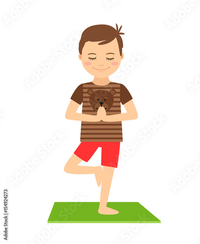 Young boy standing in yoga pose