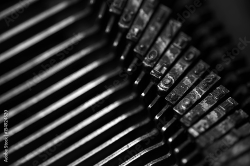 Different small metal elements of an old typewriter