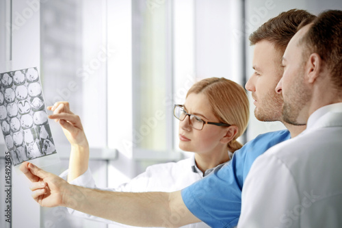 Group of doctors looking at...