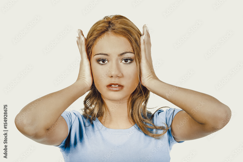 Fototapeta premium Woman covering her ears.