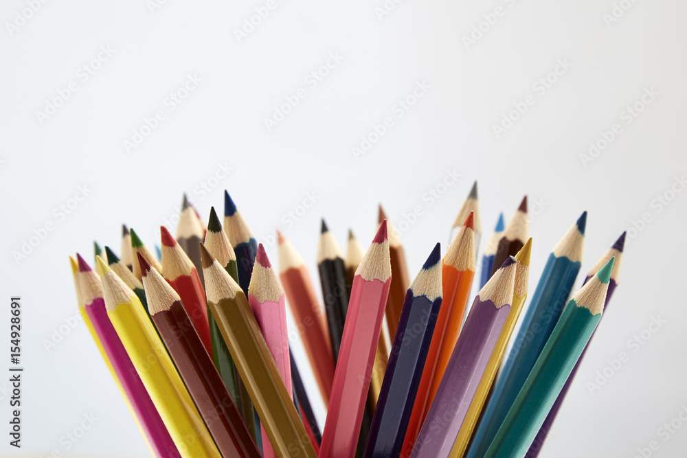 Fototapeta premium Many different colored pencils on white background