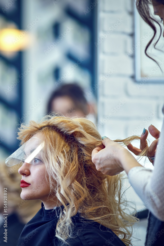Fototapeta premium Hair styling in a beauty salon .