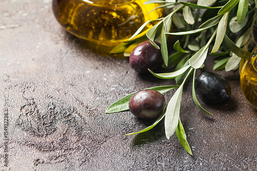 Olives on branch with leaves photo