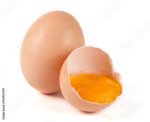 one brown egg and broken egg isolated on white background