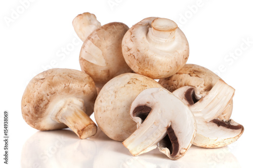 A bunch of champignon mushrooms isolated on white background