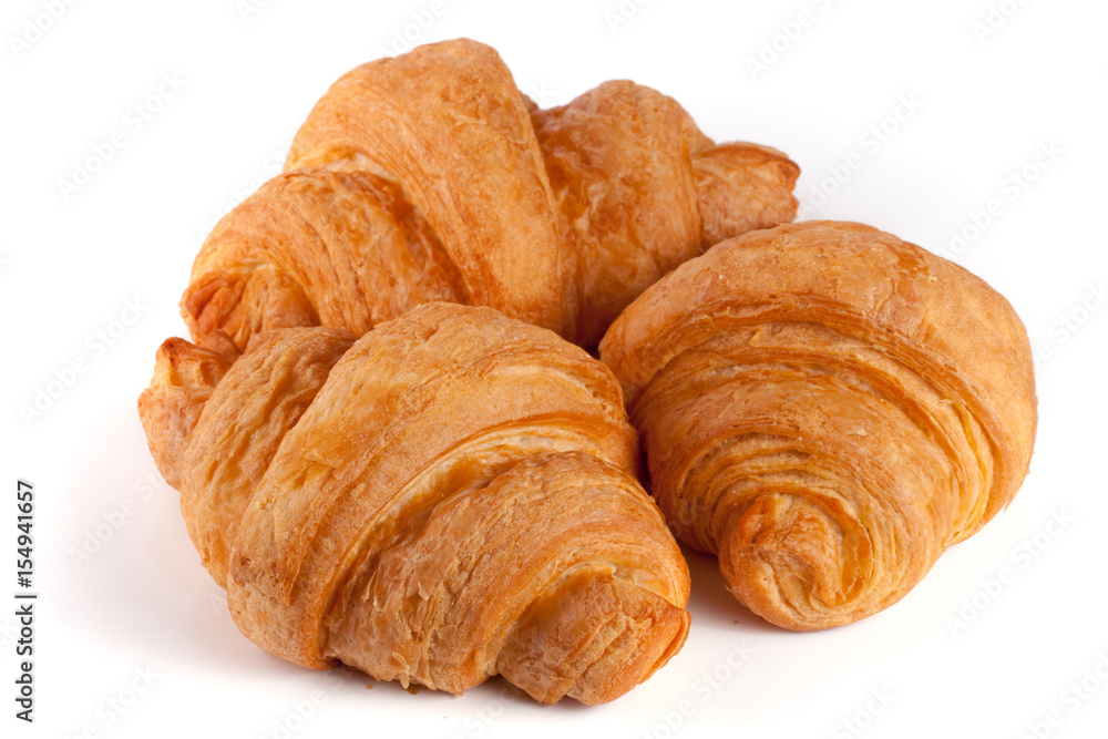 three croissant isolated on white background closeup