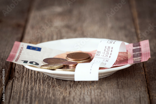 Plate with bill,money and tips