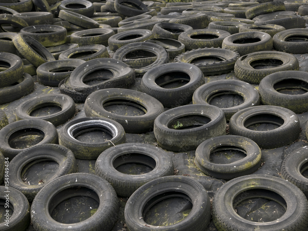 A field full of tires ready to be recycled.