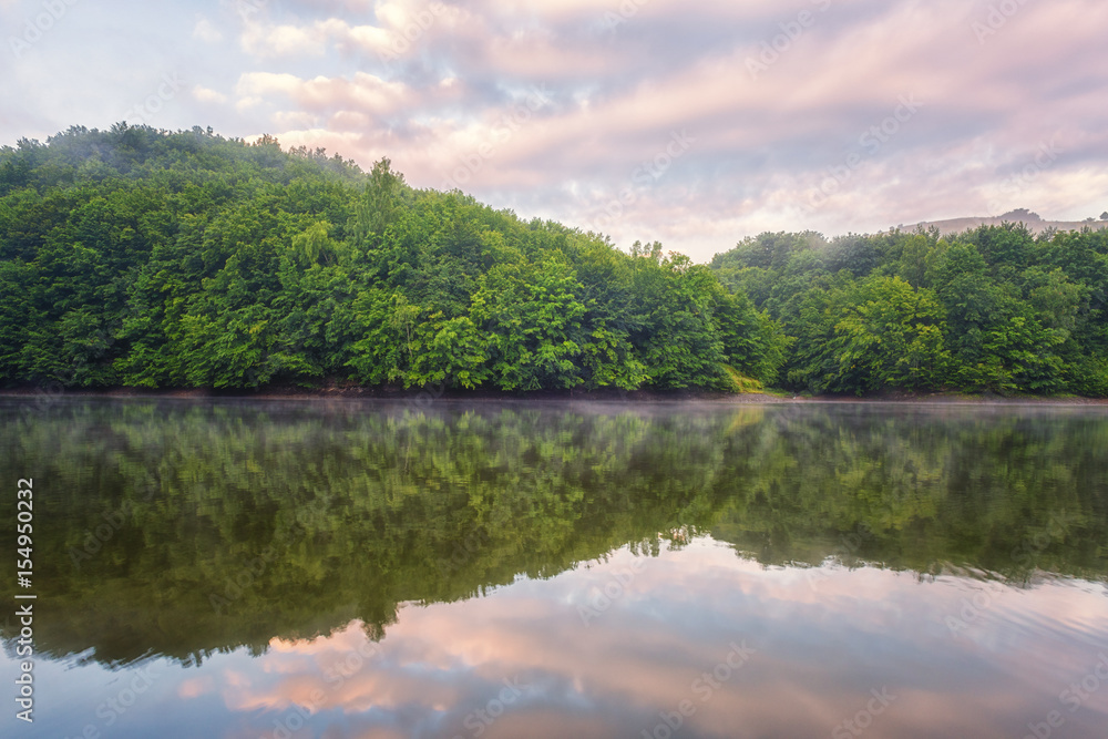 Beauty of nature wallpaper, pink sunset over green hill with reflection in the water. Recreation area reservoir Ruzin near Kosice, Slovakia Beauty of nature wallpaper, pink sunset over green hill with reflection in the water. Recreation area reservoir Ruzin near Kosice, Slovakia