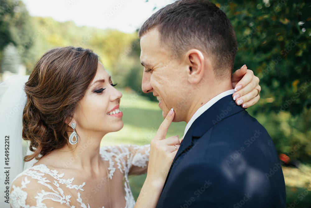 The charming brides embracing in the park The charming brides embracing in the park