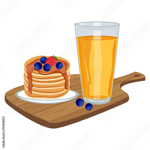 Pancakes with glass of orange juice on wooden board.