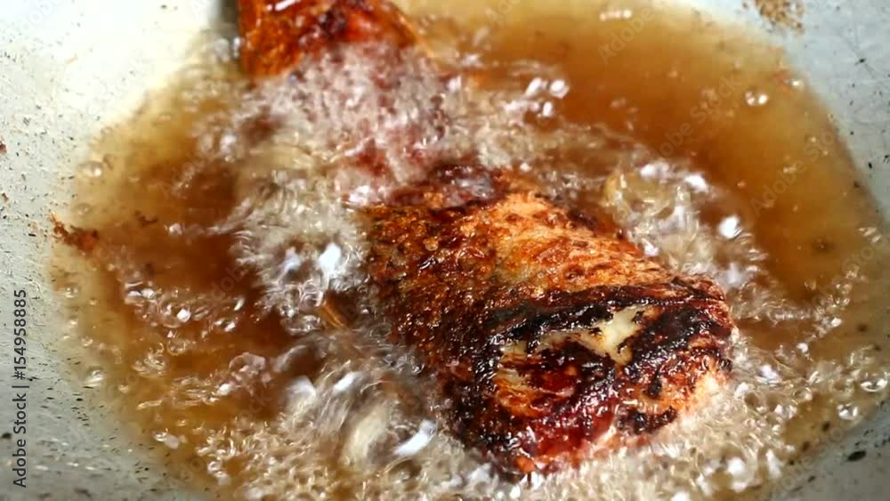 frying fish in pan frying fish in pan