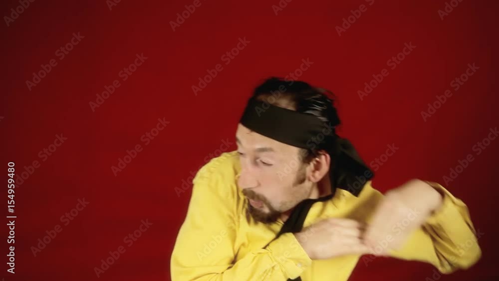 A funny ugly man fighting against an imaginary opponent and losing.
A funny ugly man fighting against an imaginary opponent and losing.