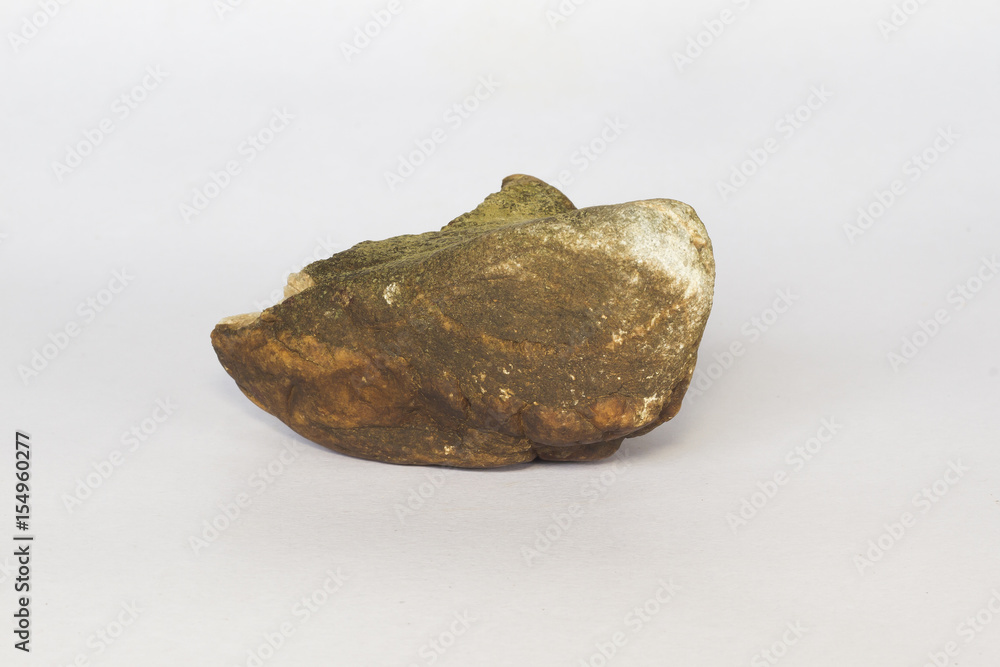 A rock isolated on white background. A rock isolated on white background.