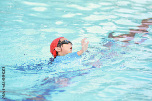 Children boy in swimming pool